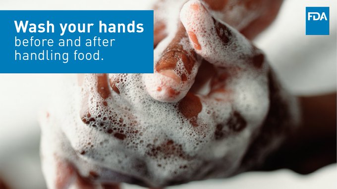 Wash your hands before and after handling food.  Washing a pair of soapy hands.