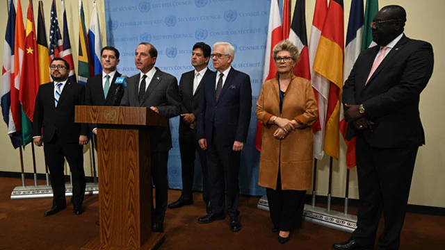 At the United Nations General Assembly, Secretary Alex Azar at a podium standing with five other men and one woman