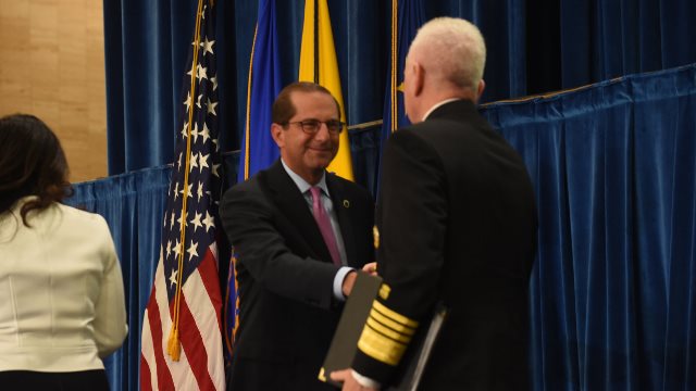 Secretary Azar greets Adm. Brett P. Giroir, M.D. at the inaugural meeting of the  The Pain Management Best Practices Inter-Agency Task Force.