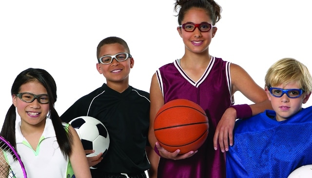 Four children wearing protective eyewear.