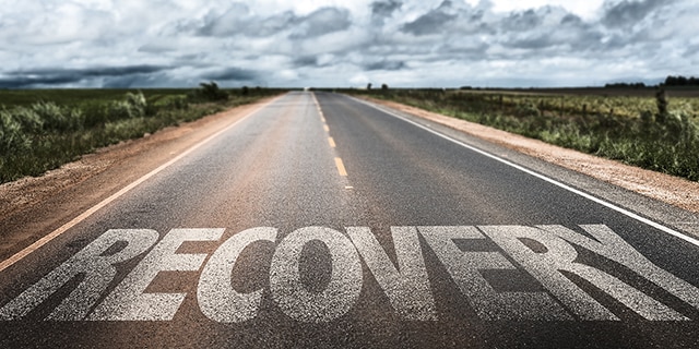 The word "recovery" on a long road