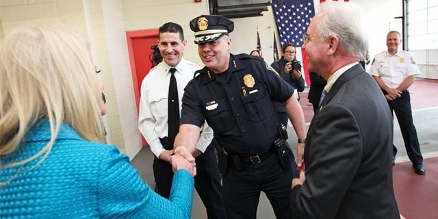 Manchester Police Chief Nick Willard greets Kellyanne Conway during a visit from Department of Health and Human Services Secretary Tom Price at Central Fire Station concerning the opioid epidemic. Concord, New Hampshire. May 10, 2017. Photo by: Jill Brady