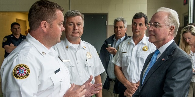 Health and Human Services (HHS) Secretary Thomas E. Price, M.D., right, discusses the opioid epidemic with Charleston Fire Dept. Lieutenant David Hodge, left, during his visit to West Virginia on May 9, 2017. Photo Credit: Bob Bird. 