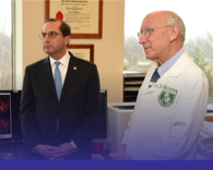 Alex Azar and person in doctor's jacket
