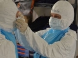 Michelle wearing protective gear in Liberia.