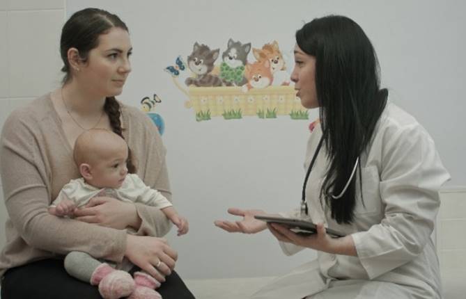 A mother talking to a pediatrician