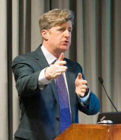 Image of Patrick Kennedy speaking at a podium