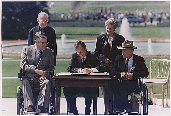 President Bush Signs into Law the Americans with Disabilities Act of 1990 on the South Lawn of the White House