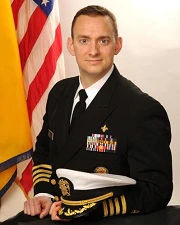 Portrait of Michael Schmoyer with U.S. flag in background