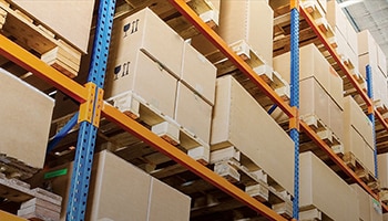 Boxes lining warehouse shelves.