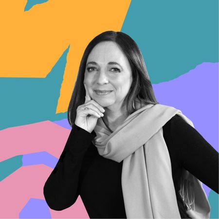 Headshot of Susan Cain in front of abstract colorful shapes