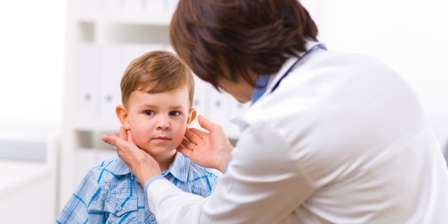 Doctor examining child