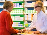 Woman consults with pharmacist